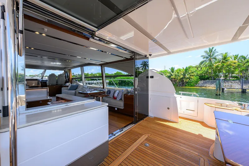Miss Amy Yacht Photos Pics Luxurious 2020 Princess F70 yacht interior with open deck, elegant seating, and scenic waterfront view.