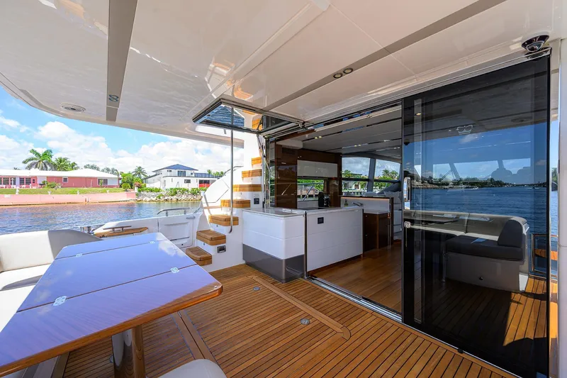 Miss Amy Yacht Photos Pics Luxurious 2020 Princess F70 yacht interior with sleek design and waterfront view.