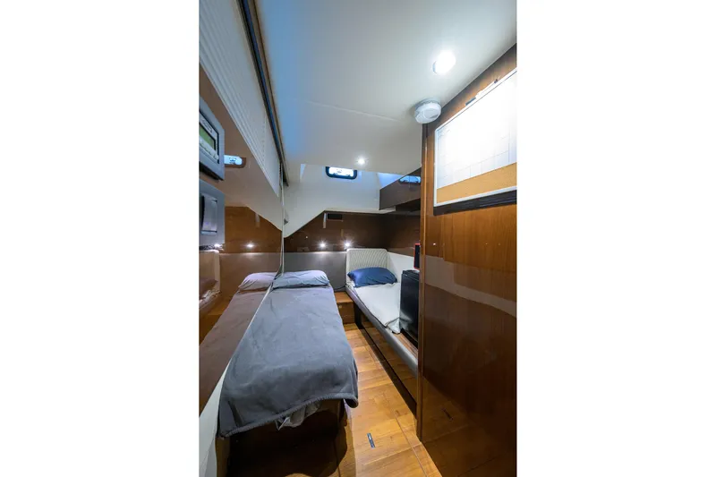 Miss Amy Yacht Photos Pics Luxurious cabin interior of 2020 Princess F70 yacht with modern design and cozy bedding.