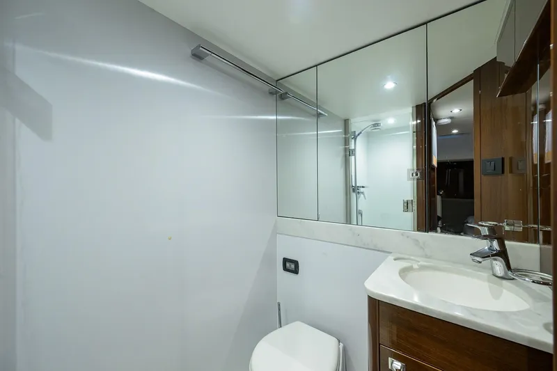 Miss Amy Yacht Photos Pics Luxurious bathroom in 2020 Princess F70 yacht with modern fixtures and mirrored walls.