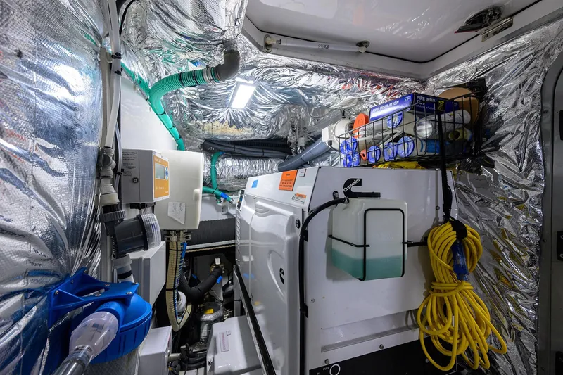 Miss Amy Yacht Photos Pics Engine room of a 2020 Princess F70 yacht with equipment and insulation.