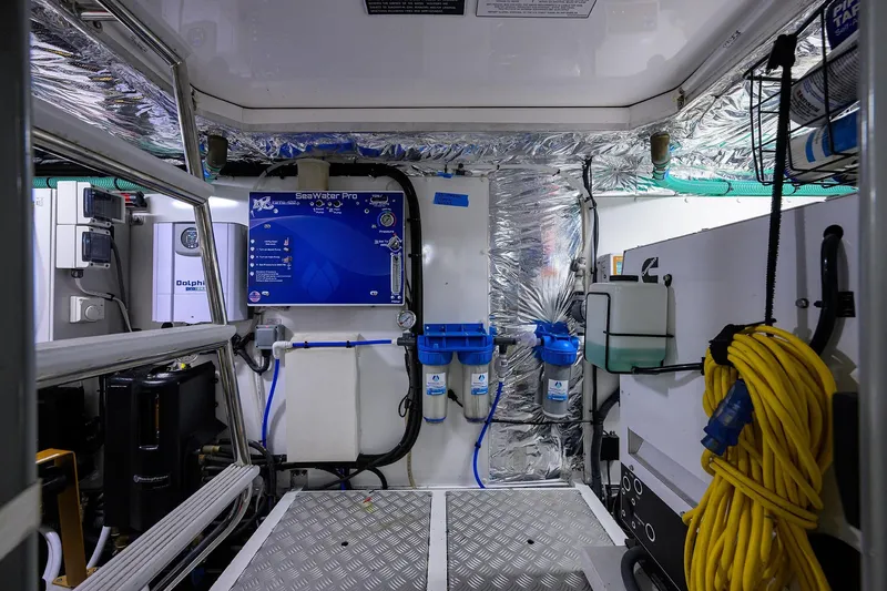 Miss Amy Yacht Photos Pics Engine room of a 2020 Princess F70 yacht with water filtration system and equipment.