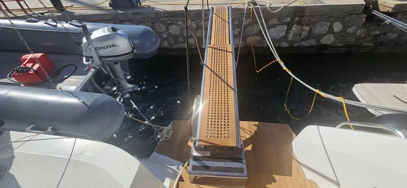  Yacht Photos Pics Lagoon 50 yacht boarding ramp with docked inflatable boat, 2022 model.