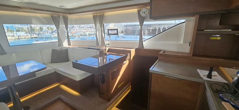  Yacht Photos Pics Luxurious interior of a 2022 Lagoon 50 catamaran with modern furnishings and ample natural light.