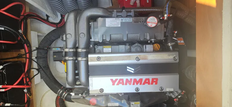 Yacht Photos Pics Yanmar engine in a 2022 Lagoon 50 catamaran, showcasing mechanical components and wiring.