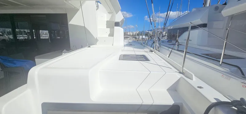  Yacht Photos Pics 2022 Lagoon 50 yacht deck with sleek design and marina view.