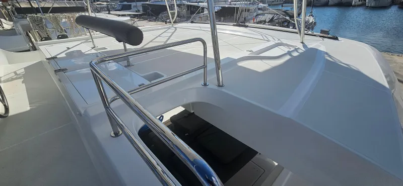  Yacht Photos Pics 2022 Lagoon 50 yacht deck with sleek design and stainless steel railings.