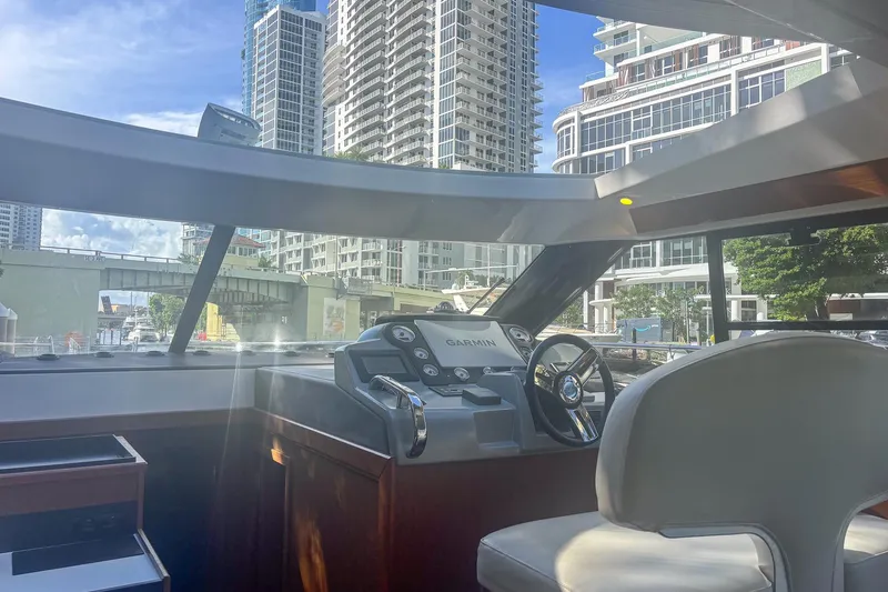 Fly-away Yacht Photos Pics Interior view of 2015 Bavaria 420 Virtess Coupe yacht with cityscape background.