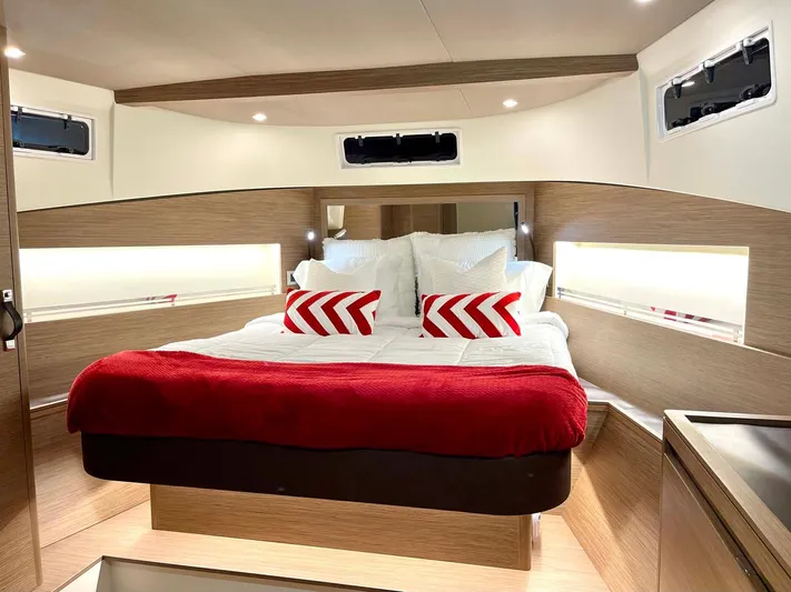  Yacht Photos Pics Luxurious interior of 2023 Solaris Power SP 44 yacht with cozy bed and modern design.