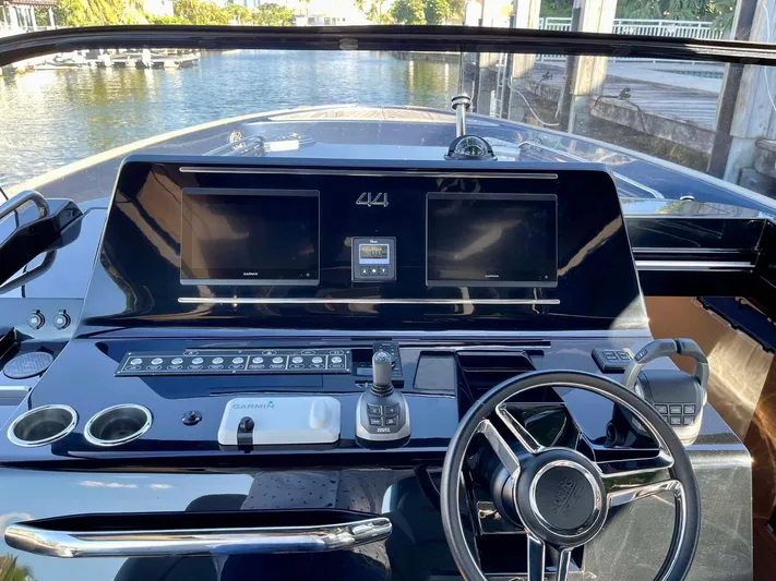  Yacht Photos Pics 2023 Solaris Power SP 44 yacht dashboard with dual screens and modern controls.
