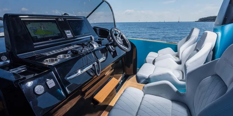  Yacht Photos Pics 2023 Solaris Power SP 44 yacht cockpit with modern controls and luxurious seating.