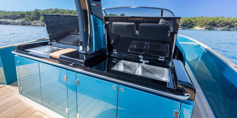  Yacht Photos Pics 2023 Solaris Power SP 44 yacht with sleek outdoor kitchen and stunning ocean backdrop.