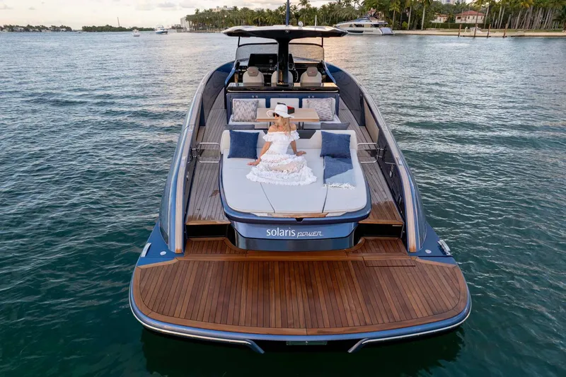  Yacht Photos Pics 2023 Solaris Power SP 44 yacht with sunbathing area on calm water.