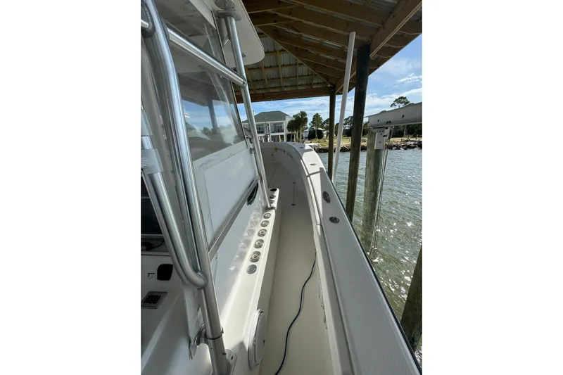  Yacht Photos Pics 2006 SeaVee 34 CC boat docked, showcasing sleek design and spacious deck.