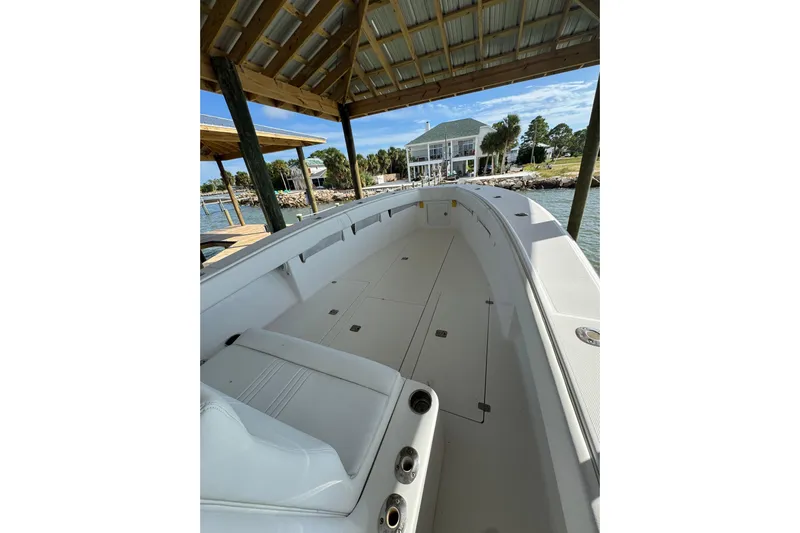  Yacht Photos Pics 2006 SeaVee 34 CC boat under dock, showcasing spacious deck and seating.