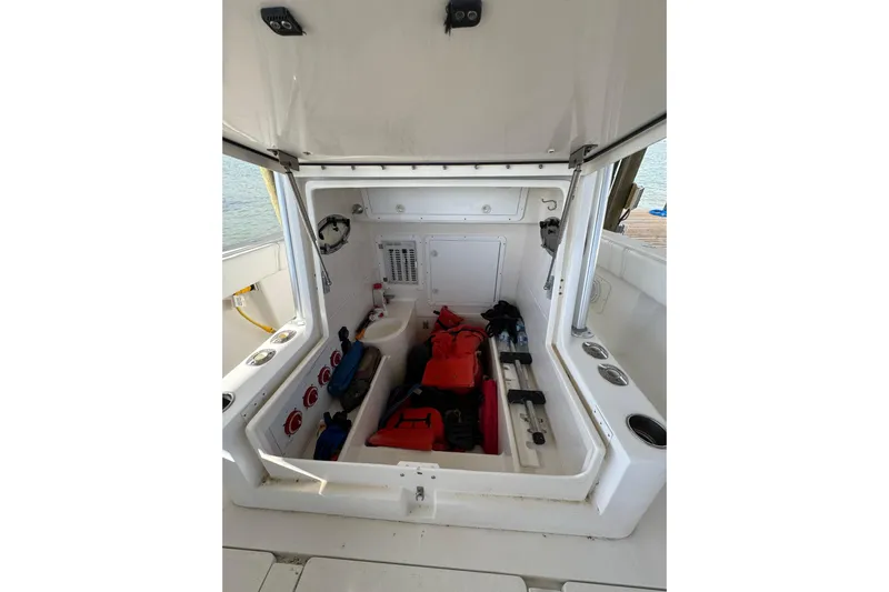  Yacht Photos Pics 2006 SeaVee 34 CC boat storage compartment with safety gear and equipment.