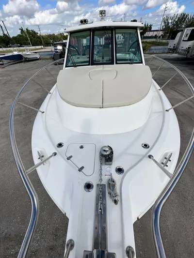  Yacht Photos Pics 2019 Boston Whaler 345 Conquest boat, docked, with clear skies and surrounding boats.