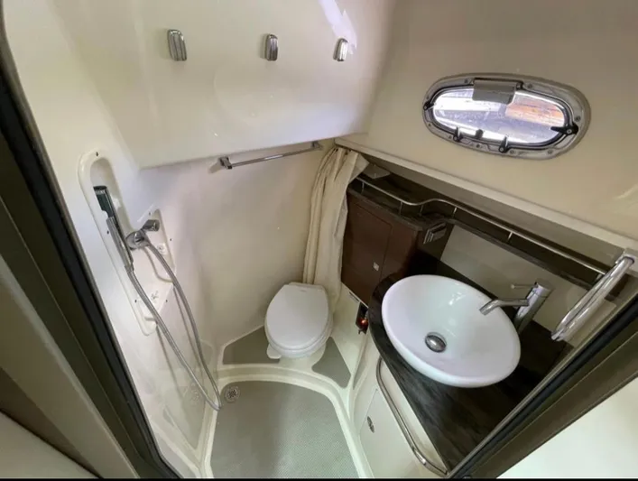  Yacht Photos Pics 2019 Boston Whaler 345 Conquest bathroom with shower, sink, and toilet.