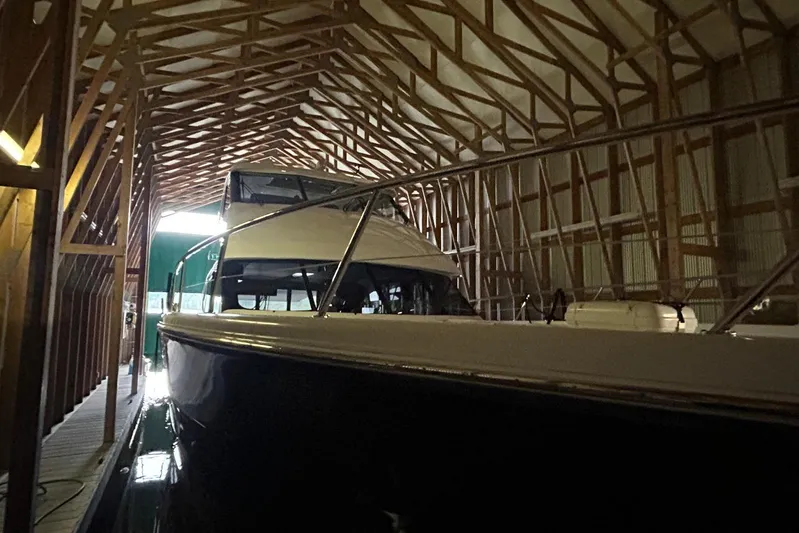  Yacht Photos Pics 2020 Maritimo M64 yacht docked in a wooden boathouse.