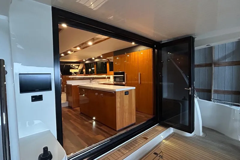  Yacht Photos Pics Luxurious interior of 2020 Maritimo M64 yacht with modern kitchen design.