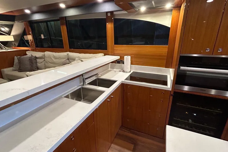  Yacht Photos Pics Luxurious kitchen interior of 2020 Maritimo M64 yacht with modern appliances and sleek design.