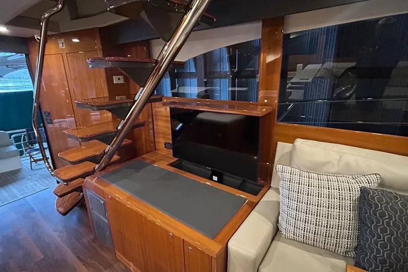  Yacht Photos Pics Luxurious interior of 2020 Maritimo M64 yacht with modern staircase and cozy seating area.