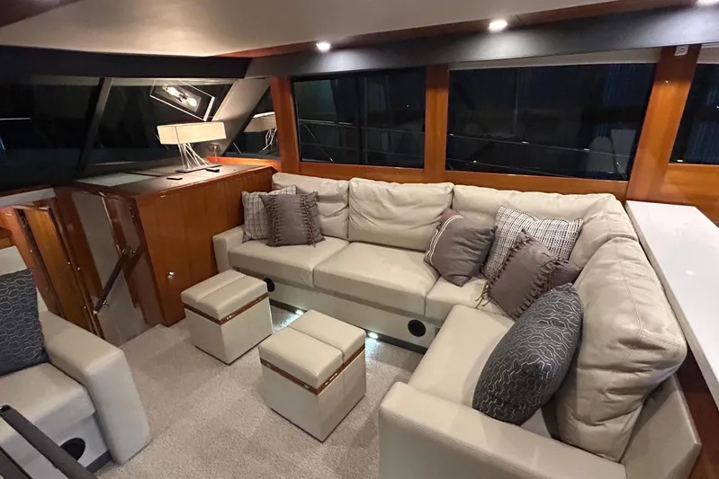  Yacht Photos Pics Luxurious interior of 2020 Maritimo M64 yacht with plush seating and elegant decor.