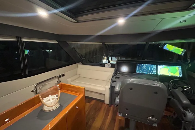  Yacht Photos Pics Luxurious 2020 Maritimo M64 yacht interior with modern navigation system and elegant seating.