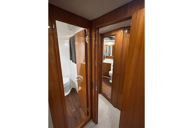  Yacht Photos Pics Luxurious wooden interior of 2020 Maritimo M64 yacht bathroom.