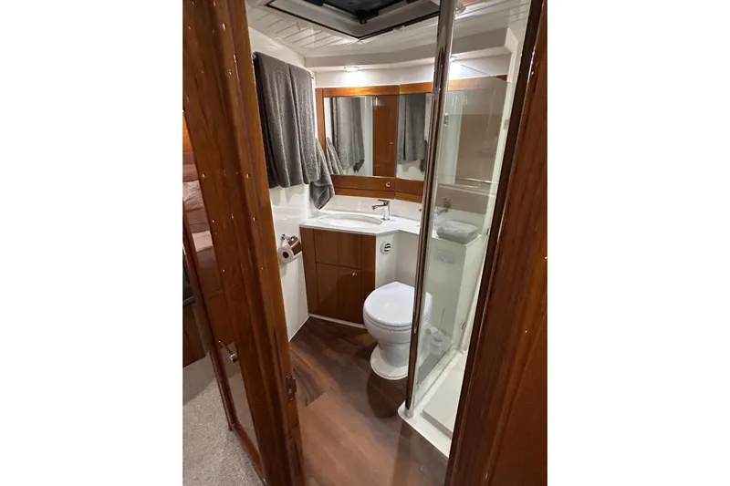  Yacht Photos Pics Luxurious bathroom in 2020 Maritimo M64 yacht with modern fixtures and wooden accents.