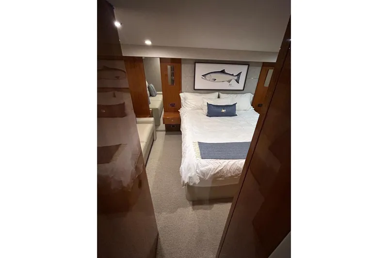  Yacht Photos Pics Luxurious bedroom interior of 2020 Maritimo M64 yacht with elegant decor.