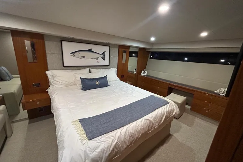  Yacht Photos Pics Luxurious bedroom interior of 2020 Maritimo M64 yacht with elegant decor and ambient lighting.