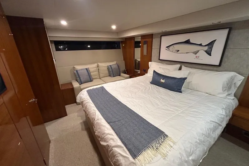  Yacht Photos Pics Luxurious bedroom interior of 2020 Maritimo M64 yacht with elegant decor and comfortable bedding.