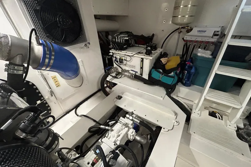  Yacht Photos Pics Engine room of 2020 Maritimo M64 yacht, featuring mechanical components and storage.