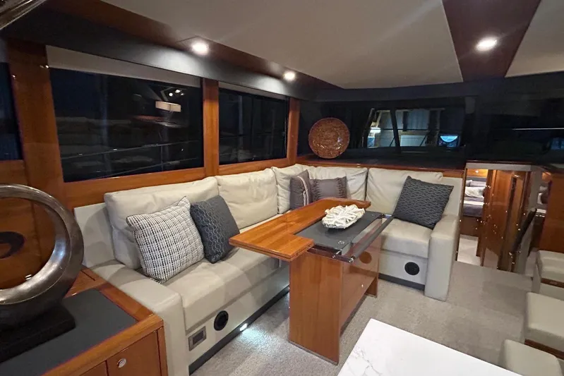  Yacht Photos Pics Luxurious interior of 2020 Maritimo M64 yacht with elegant seating and decor.