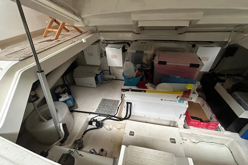  Yacht Photos Pics Engine room of a 2020 Maritimo M64 yacht with storage and equipment.