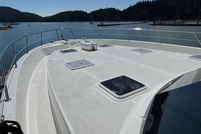  Yacht Photos Pics 2020 Maritimo M64 yacht deck with scenic harbor view.