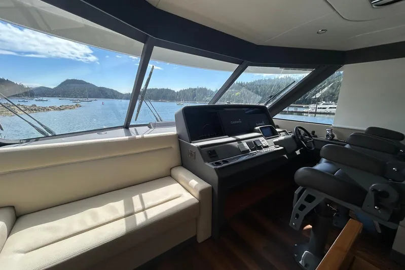 Yacht Photos Pics Luxurious 2020 Maritimo M64 yacht interior with panoramic windows and modern navigation equipment.