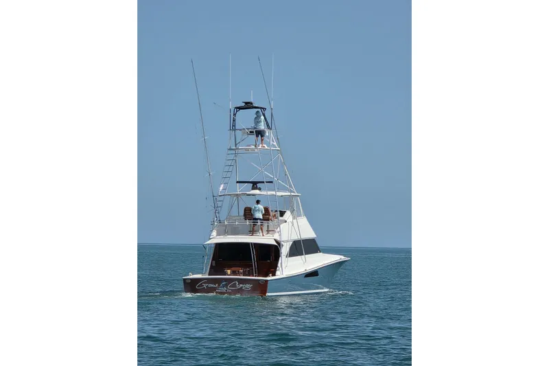  Yacht Photos Pics 2002 Viking 55 Convertible yacht cruising on open water.