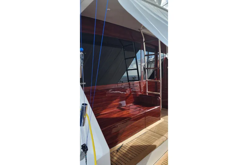  Yacht Photos Pics 2002 Viking 55 Convertible yacht with polished wood finish and sleek design.