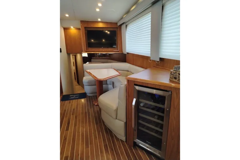  Yacht Photos Pics Luxurious interior of a 2002 Viking 55 Convertible yacht with wood flooring and modern amenities.
