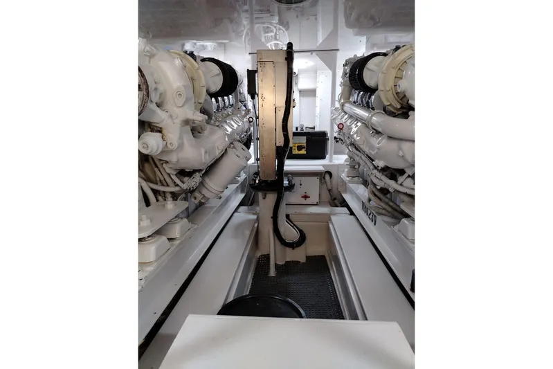  Yacht Photos Pics Engine room of a 2002 Viking 55 Convertible yacht, showcasing dual engines and mechanical components.