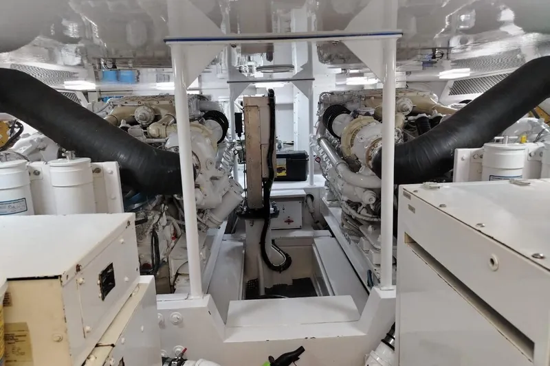  Yacht Photos Pics Engine room of a 2002 Viking 55 Convertible yacht, showcasing dual engines and machinery.