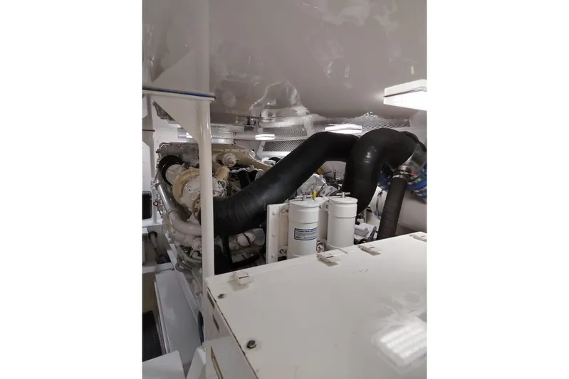  Yacht Photos Pics Engine room of a 2002 Viking 55 Convertible yacht, showcasing machinery and components.