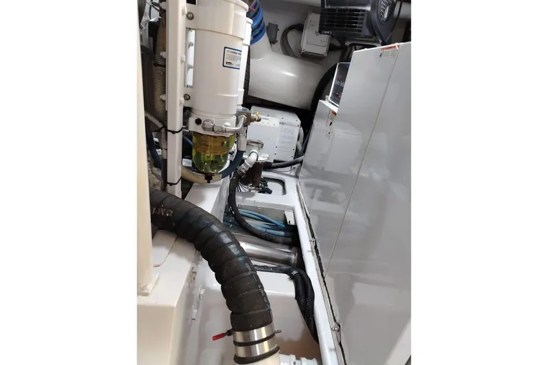  Yacht Photos Pics Engine room of 2002 Viking 55 Convertible yacht, showcasing mechanical components and systems.