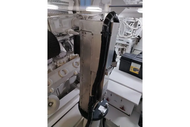  Yacht Photos Pics Engine room of 2002 Viking 55 Convertible yacht, showcasing mechanical components.