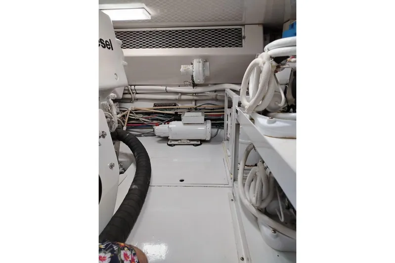  Yacht Photos Pics Engine room of 2002 Viking 55 Convertible yacht, showcasing mechanical components and wiring.