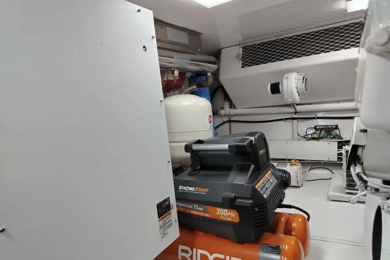  Yacht Photos Pics Engine room of 2002 Viking 55 Convertible with compressor and equipment.