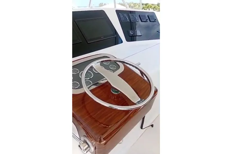  Yacht Photos Pics Steering wheel and dashboard of 2002 Viking 55 Convertible yacht.