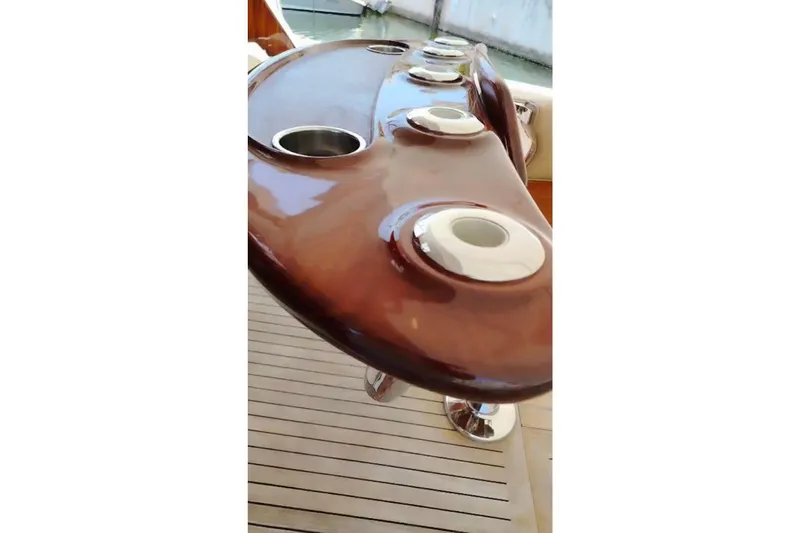  Yacht Photos Pics Luxurious wooden fishing rod holder on 2002 Viking 55 Convertible yacht deck.